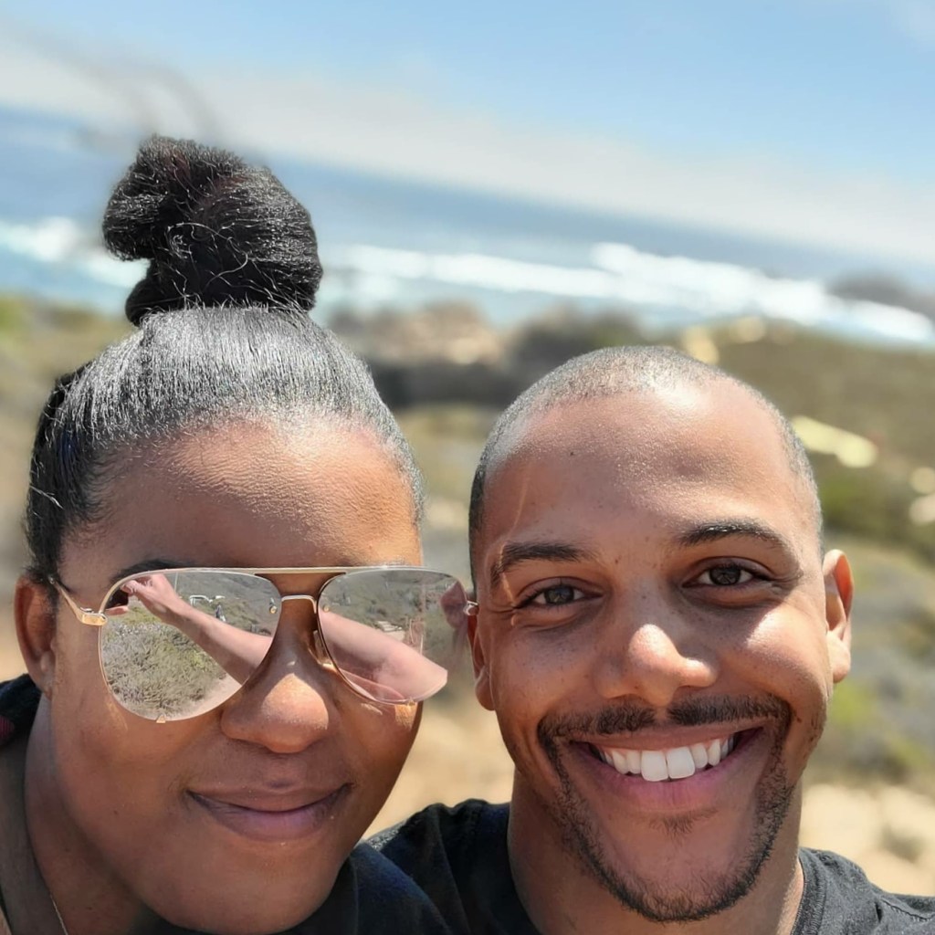 DC EASY and his wife smiling for a selfie.
